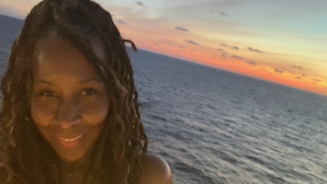 Nettye Johnson on ship during sunset